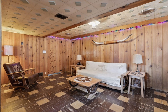 unfurnished room featuring wood walls