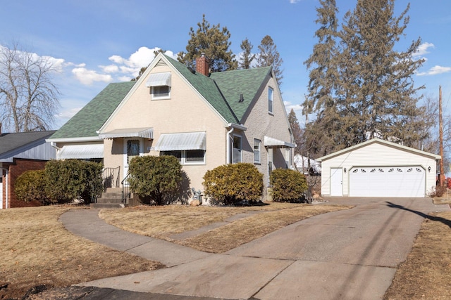 view of front of home with an outbuilding and a garage