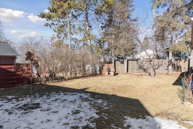 view of yard covered in snow