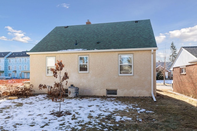 view of snow covered house