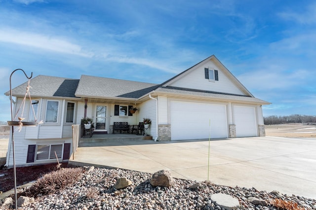 ranch-style house featuring a garage