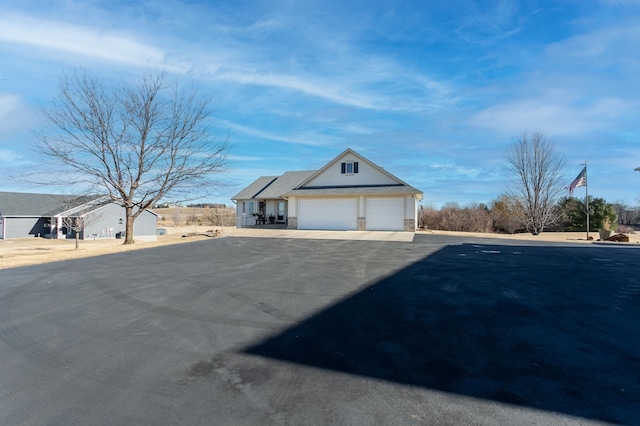 view of side of property featuring a garage