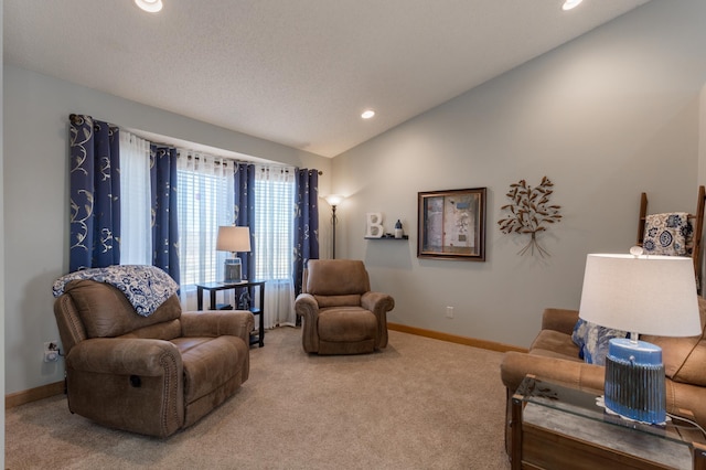 carpeted living room featuring lofted ceiling