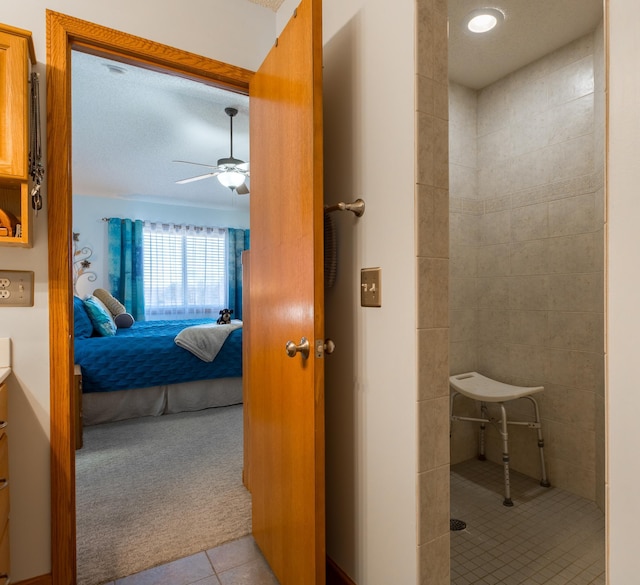 bathroom featuring ceiling fan, vanity, and tile patterned flooring