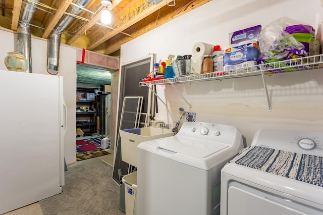 clothes washing area featuring washing machine and dryer and sink