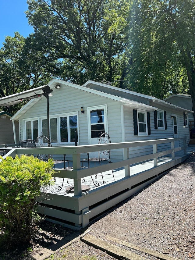 view of front of property featuring a wooden deck