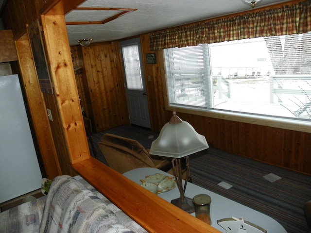 sitting room with wood walls