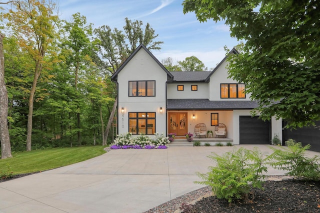 view of front facade featuring a garage and a front yard