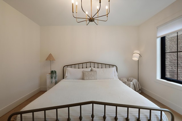 bedroom with a notable chandelier