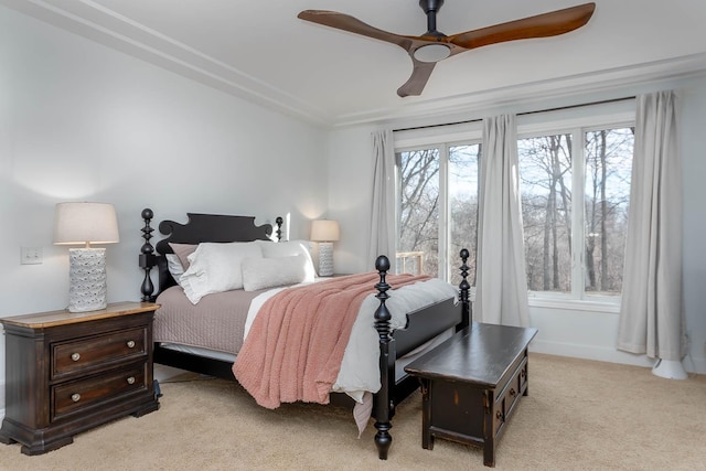 bedroom with light colored carpet and ceiling fan