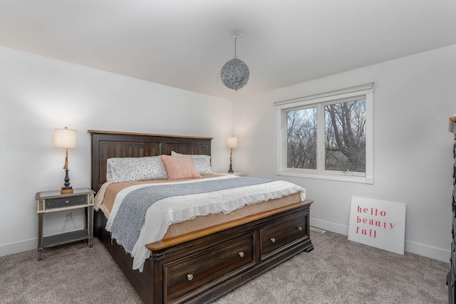 bedroom featuring light carpet