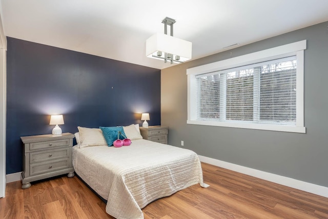 bedroom with light wood-type flooring