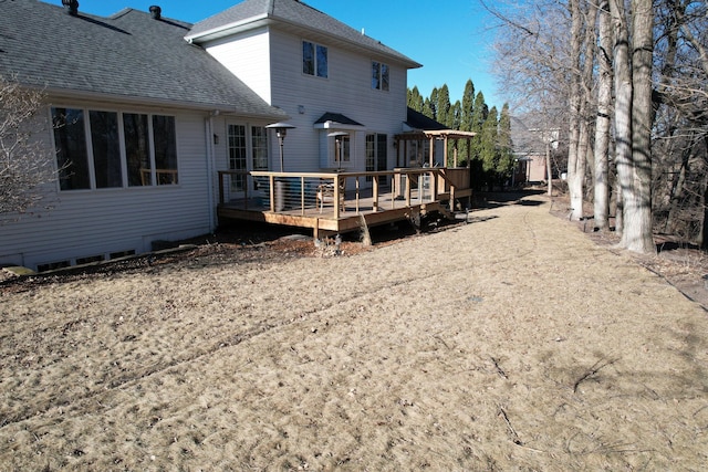 back of house featuring a deck