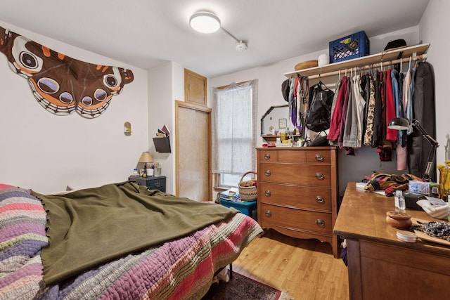 bedroom with hardwood / wood-style flooring