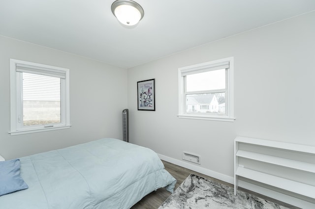 bedroom featuring dark hardwood / wood-style flooring