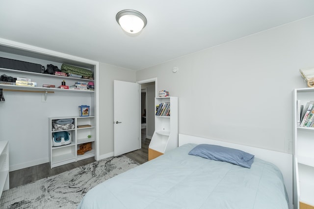 bedroom with dark wood-type flooring