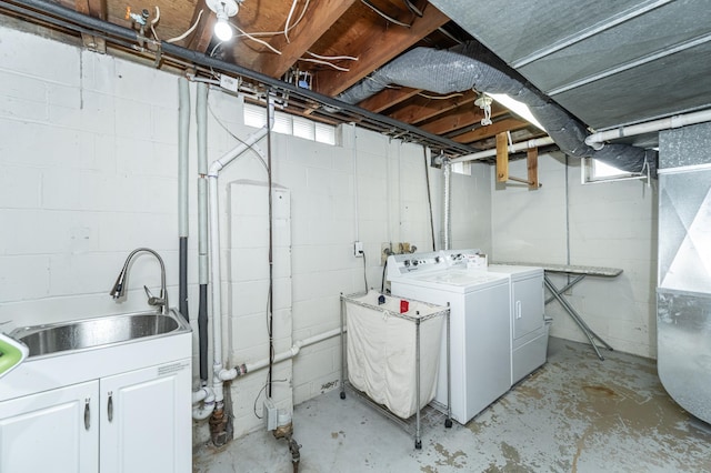 washroom featuring sink and independent washer and dryer