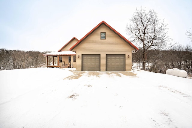 view of front of property featuring a garage and a porch