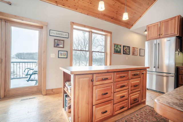 kitchen featuring high end fridge, vaulted ceiling, wooden ceiling, and light hardwood / wood-style flooring