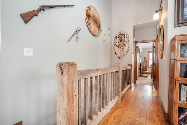 corridor with light hardwood / wood-style flooring