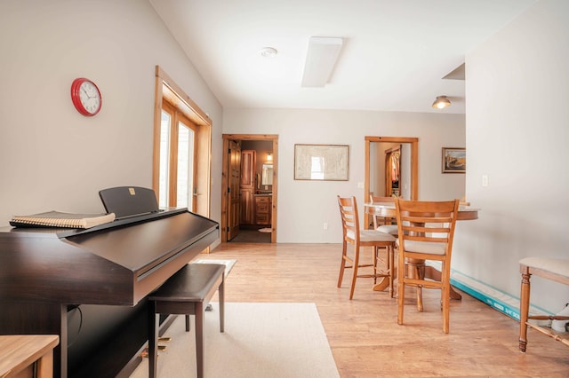 dining space with light hardwood / wood-style flooring