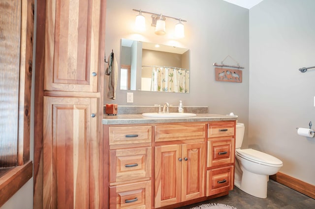 bathroom featuring vanity, a shower with curtain, and toilet