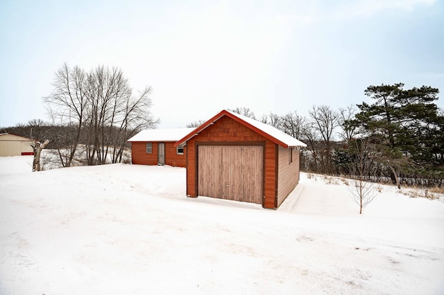 view of snow covered garage