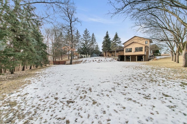 view of yard layered in snow