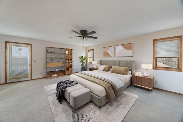 bedroom featuring light colored carpet, access to exterior, and ceiling fan