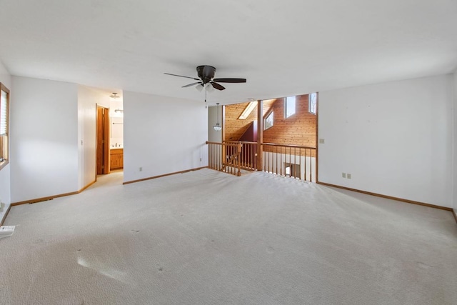 spare room with light carpet and ceiling fan