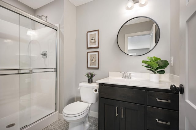 full bath featuring toilet, a stall shower, baseboards, and vanity