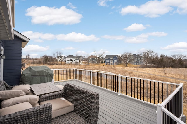 deck with a residential view and grilling area