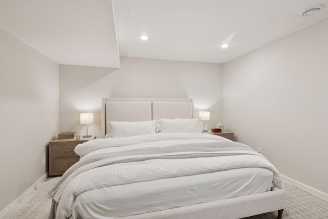 bedroom with light colored carpet