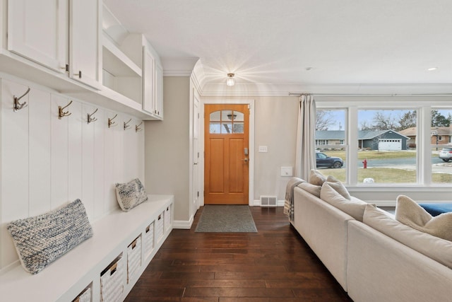 mudroom with crown molding and dark hardwood / wood-style flooring