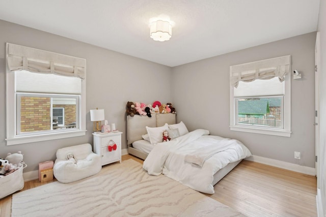 bedroom with light hardwood / wood-style flooring
