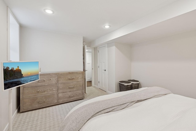 bedroom with light colored carpet