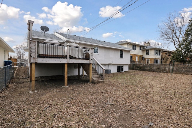back of property featuring a wooden deck and cooling unit