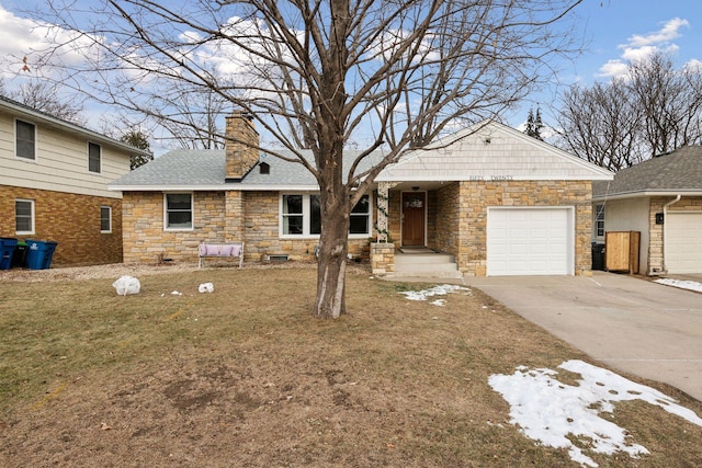 view of front of property with a garage and a front lawn