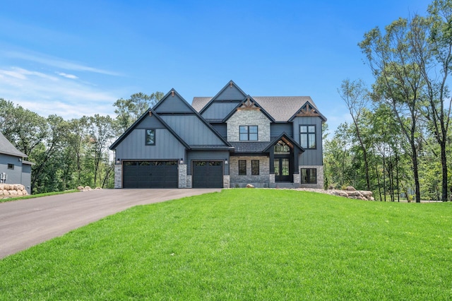 view of front of property with a garage and a front yard