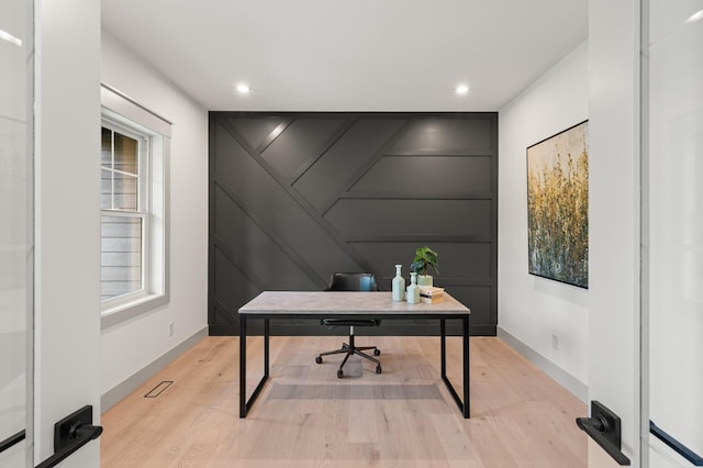 office area with light hardwood / wood-style flooring