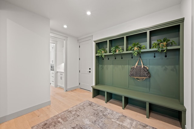 mudroom with hardwood / wood-style floors