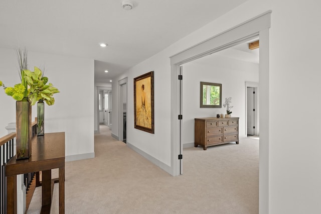 corridor with light colored carpet