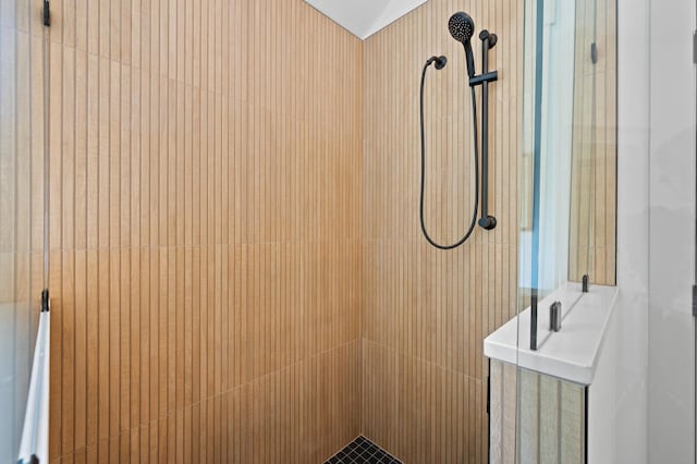 bathroom with tiled shower