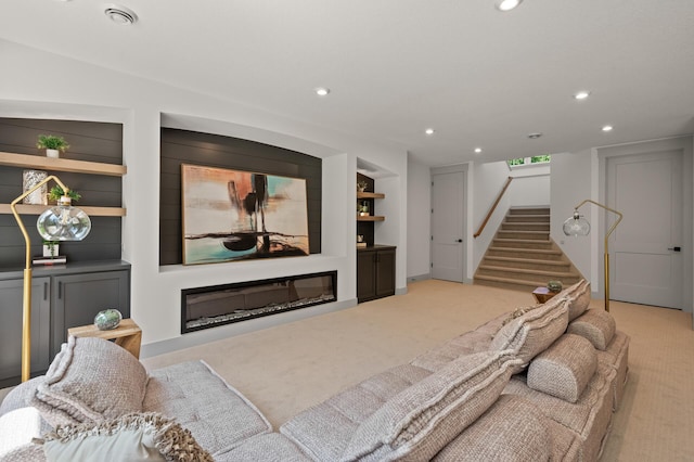 carpeted living room with built in shelves