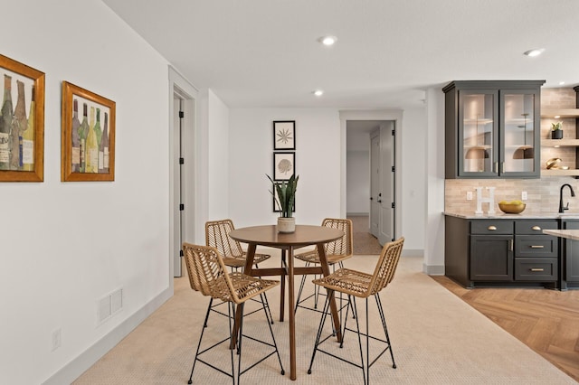 dining space with light parquet flooring