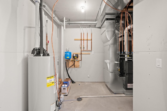 utility room featuring water heater