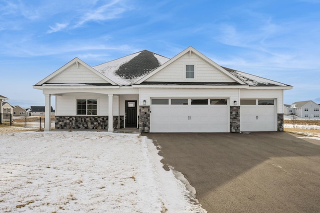 view of front facade with a porch and a garage