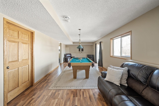 game room featuring billiards, a textured ceiling, baseboards, and wood finished floors