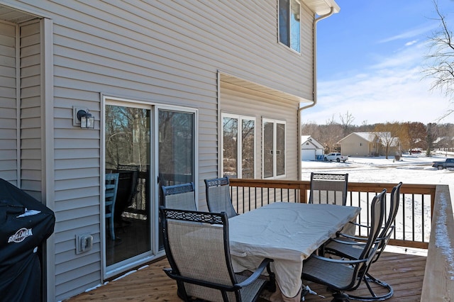 snow covered deck featuring grilling area