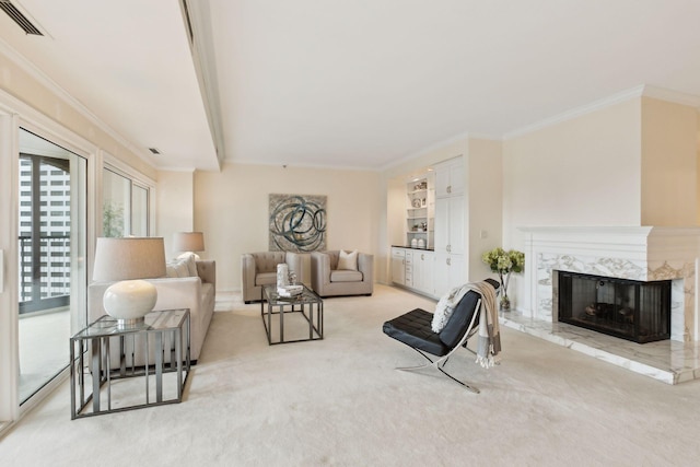 carpeted living room featuring crown molding and a high end fireplace